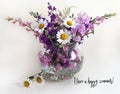 Bouquet of delphinium, chamomile and daylily. Flowers in a bouquet of country style in a glass vase. Royalty Free Stock Photo