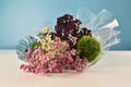 Bouquet of different flowers on white table Royalty Free Stock Photo