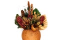 Bouquet of dried flowers in a vase, beautiful ikebana Composition of unusual yellow, green and red plants. Isolate on white