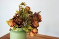 Bouquet of dried flowers in vase on table and light background. A bouquet of dried flowers in a vase. Dry flowers