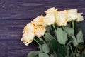 Bouquet of roses on a wooden background