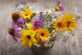 Bouquet of field wild flowers in a vase on old boards Royalty Free Stock Photo