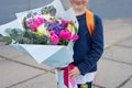 a bouquet for the first beloved teacher on the first of September. Flowers for the last bell. day of knowledge. beginning of the Royalty Free Stock Photo