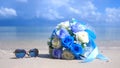 Bouquet beautiful flowers and sunglasses on the beach white sand tropical paradise island on sea water ocean background Royalty Free Stock Photo