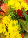 Bouquet of flowers, close-up composition of a bouquet of flowers, red roses, sunflowers, green leaves Royalty Free Stock Photo