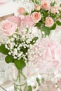 Bouquet of flowers in a glass vase on the festive table in the restaurant Royalty Free Stock Photo