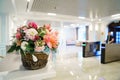 bouquet of flowers in hall . large classic wooden door. entrance and turnstile