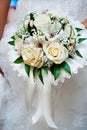 Bouquet of flowers in hand of bride