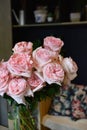 Bouquet of flowers on a leg in the interior of the restaurant for a celebration shop floristry or wedding salon Royalty Free Stock Photo