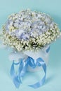 Bouquet of flowers made of hydrangeas and gypsophila in a white box with a bow. Royalty Free Stock Photo