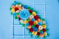 Bouquet of flowers made with paper on a blue surface Royalty Free Stock Photo