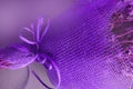 A bouquet of flowers is packaged in a purple mesh for flower arranging, close-up, outdoor frame