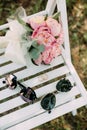 Bouquet flowers rings sunglasses wedding decor outside