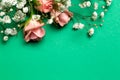 Bouquet of flowers, roses on green deep background. Top view with copy space