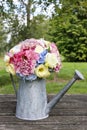 Bouquet of flowers in silver watering can Royalty Free Stock Photo