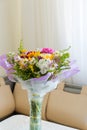 Bouquet of flowers on table in the room Royalty Free Stock Photo