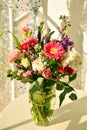 Bouquet of flowers on the table. Spring floral blooming background.