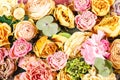 A bouquet of flowers on top. Closeup. Multi-colored roses