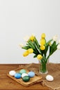 bouquet of flowers in a vase easter eggs decoration holiday tradition light background Royalty Free Stock Photo