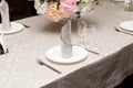 a bouquet of flowers in vase on served tables at the wedding. banquet concept Royalty Free Stock Photo