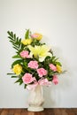 Bouquet of flowers in vase on wooden table Royalty Free Stock Photo