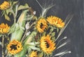 Bouquet of flowers and vegetables: sunflowers, corn, poppies boxes, wheat and oats on dark background. Autumn harvest. Royalty Free Stock Photo