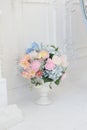 Bouquet of flowers in a white vase. Royalty Free Stock Photo