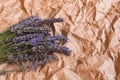 Bouquet of fragrant fresh lavender flowers on beige craft paper background Royalty Free Stock Photo