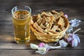 Bouquet of fresh beer and snacks with homemade, salted, rye rusks with garlic for beer.
