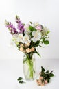 Bouquet of fresh flowers of snapdragon, roses, alstroemeria in a