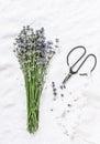 Bouquet of fresh lavender, vintage scissors on a light background, top view. Royalty Free Stock Photo