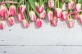 Bouquet of fresh pink tulips on white wooden background. Festive concept for Mother\'s Day Royalty Free Stock Photo