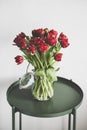 Bouquet of fresh Spring red tulips in glass jar Royalty Free Stock Photo