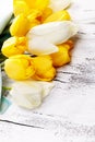 Bouquet of fresh spring tulip flowers on white wooden table