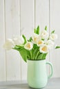 Bouquet of fresh white tulips in vase. Greeting card for mother`s day or happy birthday. Space for text. Easter, Spring or summer