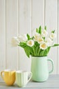 Bouquet of fresh white tulips in vase. Greeting card for mother`s day or happy birthday. Space for text. Easter, Spring or summer