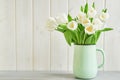 Bouquet of fresh white tulips in vase. Greeting card for mother`s day or happy birthday. Space for text. Easter, Spring or summer