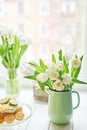 Bouquet of fresh white tulips in vase. Greeting card for mother`s day or happy birthday. Space for text. Easter, Spring or summer