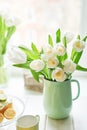 Bouquet of fresh white tulips in vase. Greeting card for mother`s day or happy birthday. Space for text. Easter, Spring or summer