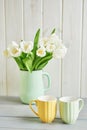 Bouquet of fresh white tulips in vase. Greeting card for mother`s day or happy birthday. Space for text. Easter, Spring or summer