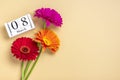 Bouquet of gerbera flowers, calendar with date 08 march on beige background Holiday greeting card International womens Royalty Free Stock Photo