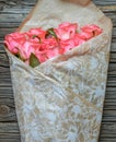 Bouquet of gift wrapped pink roses