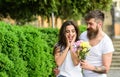 Bouquet always good idea. Bring her favorite flowers. Surprise for her. Man gives flower bouquet girl romantic date Royalty Free Stock Photo