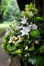 Bouquet with green orchids, roses and lilies