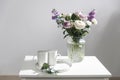 Bouquet of hackelia velutina, purple and white roses,
