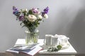 Bouquet of hackelia velutina, purple and white roses,