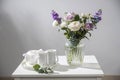 hackelia velutina, purple and white roses, small tea roses, matthiola incana and blue iris in glass vase is on the Royalty Free Stock Photo