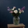 Bouquet of hackelia velutina, purple and white roses,