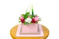 A bouquet of handmade soap in the form of roses and raspberries wooden creative planter on a white