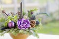 Bouquet has Christmas tree branches and artificial flowers. Royalty Free Stock Photo